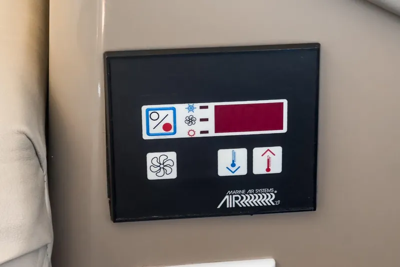 Kathy's Dream Yacht Photos Pics Control panel of a 2000 Carver 450 Voyager Pilothouse boat, featuring temperature and fan settings.