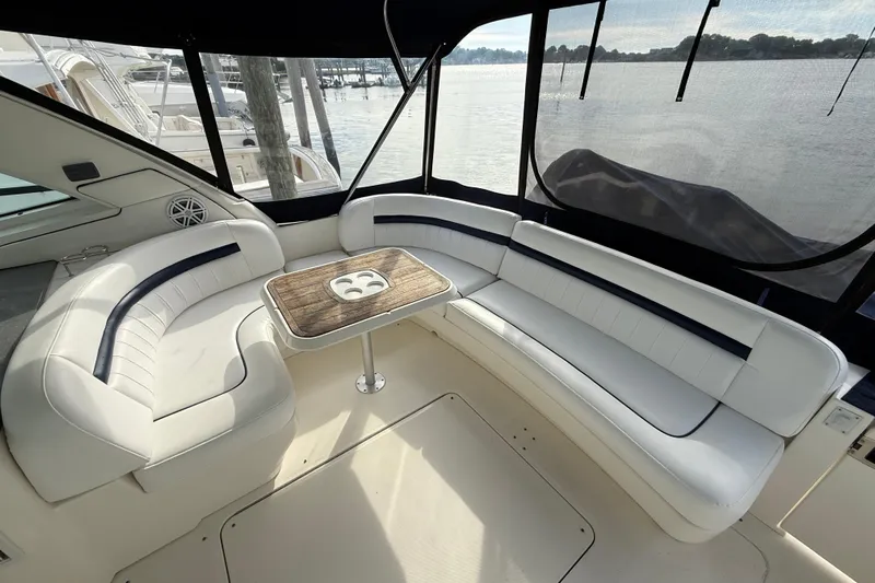 Turn The Page Yacht Photos Pics Luxurious seating area on 2006 Sea Ray 48 Sundancer yacht with waterfront view.