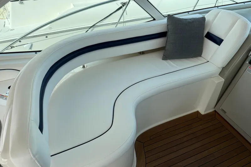 Turn The Page Yacht Photos Pics Luxurious seating area on 2006 Sea Ray 48 Sundancer yacht with elegant white upholstery.