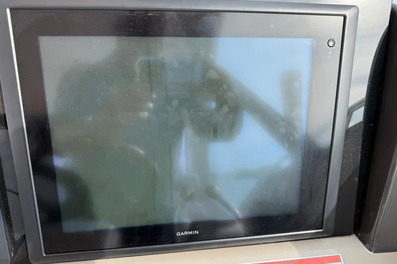 Turn The Page Yacht Photos Pics Garmin display screen on 2006 Sea Ray 48 Sundancer yacht dashboard.