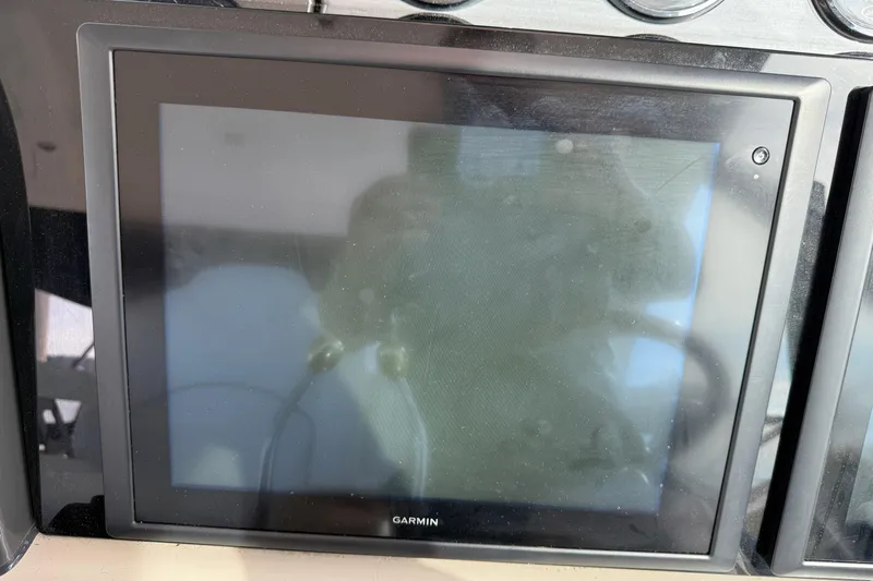 Turn The Page Yacht Photos Pics Garmin display on 2006 Sea Ray 48 Sundancer yacht dashboard.