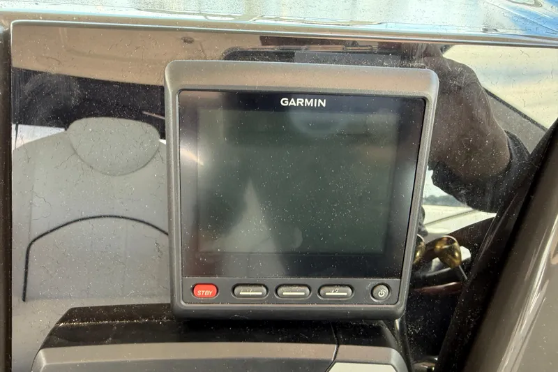 Turn The Page Yacht Photos Pics Garmin display on 2006 Sea Ray 48 Sundancer yacht dashboard.