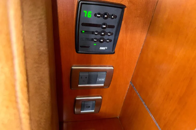 Turn The Page Yacht Photos Pics Control panel and switches on 2006 Sea Ray 48 Sundancer yacht interior.