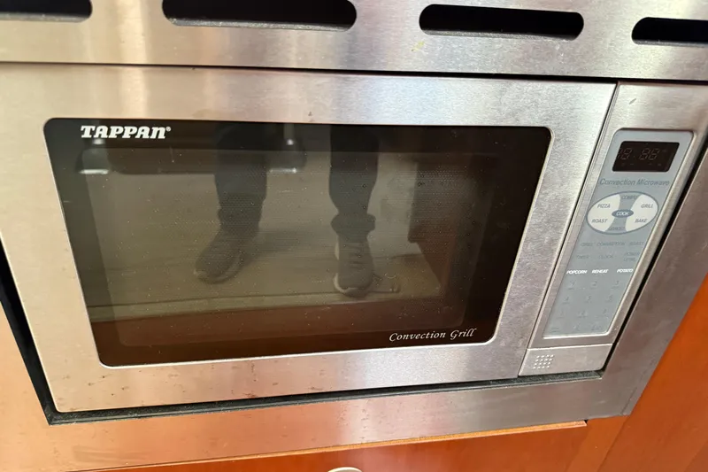 Turn The Page Yacht Photos Pics Tappan convection grill microwave in 2006 Sea Ray 48 Sundancer yacht kitchen.