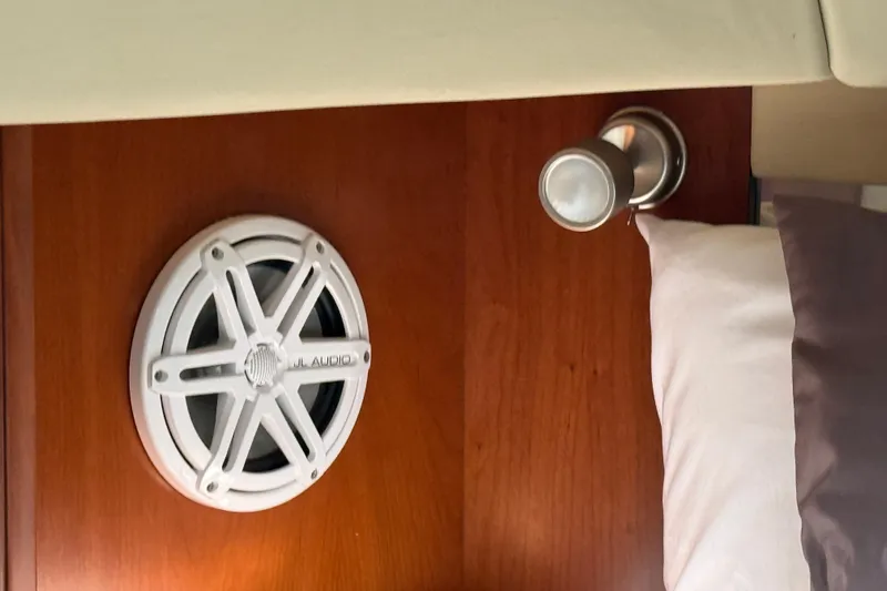 Turn The Page Yacht Photos Pics Interior of 2006 Sea Ray 48 Sundancer with JL Audio speaker and wall light.