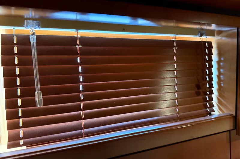 Turn The Page Yacht Photos Pics Wooden blinds on a 2006 Sea Ray 48 Sundancer yacht window.