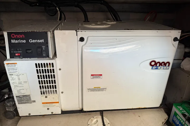 Turn The Page Yacht Photos Pics Onan marine generator in 2006 Sea Ray 48 Sundancer yacht engine room.