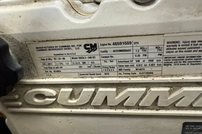 Turn The Page Yacht Photos Pics Cummins engine label on 2006 Sea Ray 48 Sundancer, detailing specifications and warnings.
