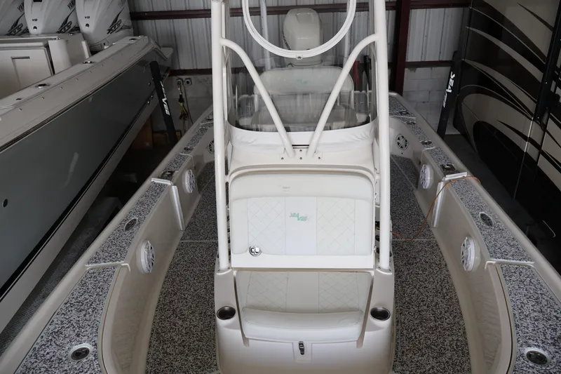  Yacht Photos Pics 2019 SeaVee 270Z boat in storage, showcasing sleek design and spacious deck.