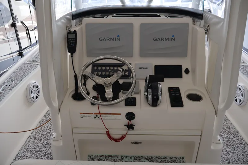  Yacht Photos Pics 2019 SeaVee 270Z boat helm with Garmin displays and Mercury controls.