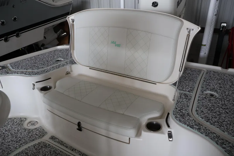  Yacht Photos Pics 2019 SeaVee 270Z boat with open storage compartment and cushioned seating.