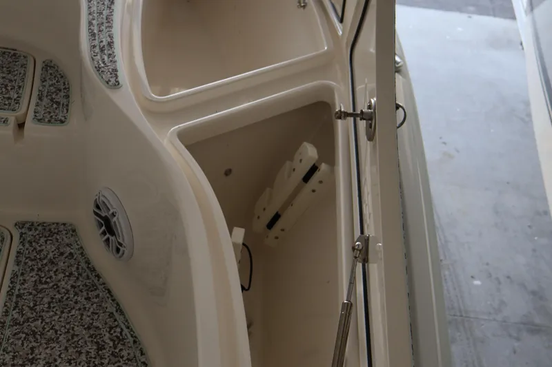  Yacht Photos Pics 2019 SeaVee 270Z boat storage compartment with open hatch and speaker.