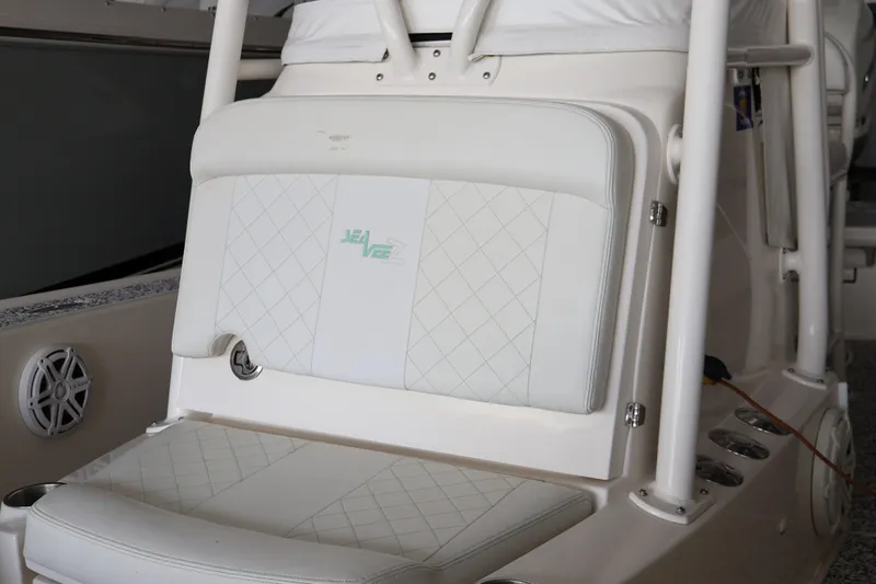  Yacht Photos Pics 2019 SeaVee 270Z boat interior with white cushioned seating and speaker detail.