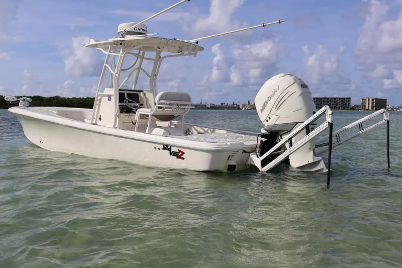  Yacht Photos Pics 2019 SeaVee 270Z boat in shallow water, featuring a Mercury engine and Garmin equipment.