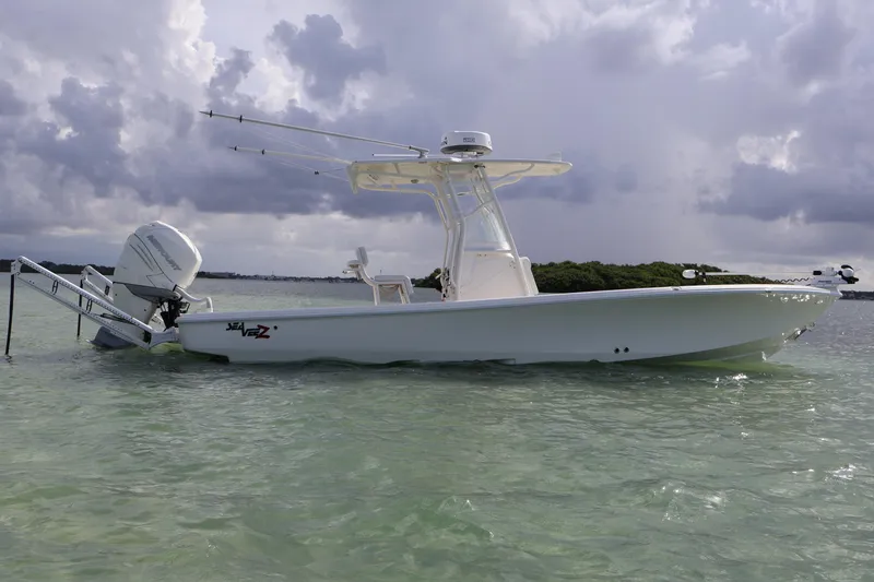  Yacht Photos Pics 2019 SeaVee 270Z boat in shallow water under cloudy skies.