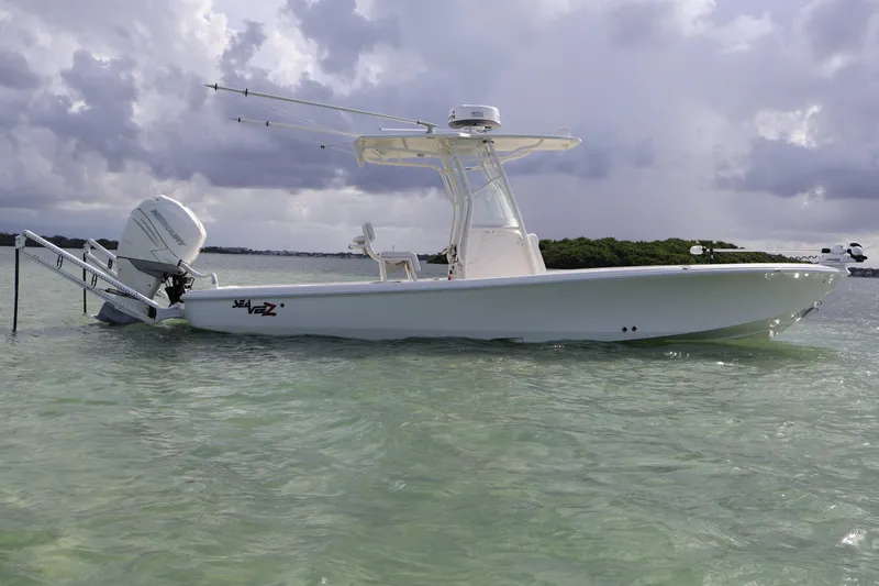  Yacht Photos Pics 2019 SeaVee 270Z boat in calm waters under cloudy skies.