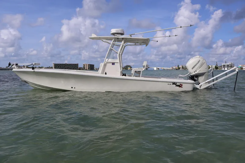  Yacht Photos Pics 2019 SeaVee 270Z boat on water, clear sky, coastal background.