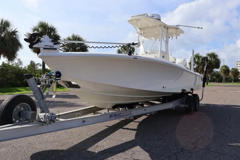 Yacht Photos Pics 2019 SeaVee 270Z boat on trailer, parked outdoors with palm trees in background.