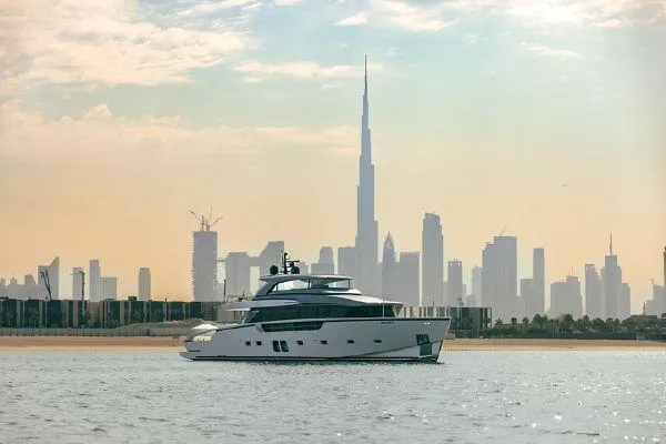  Yacht Photos Pics Sanlorenzo SX88 yacht cruising with Dubai skyline and Burj Khalifa in the background.