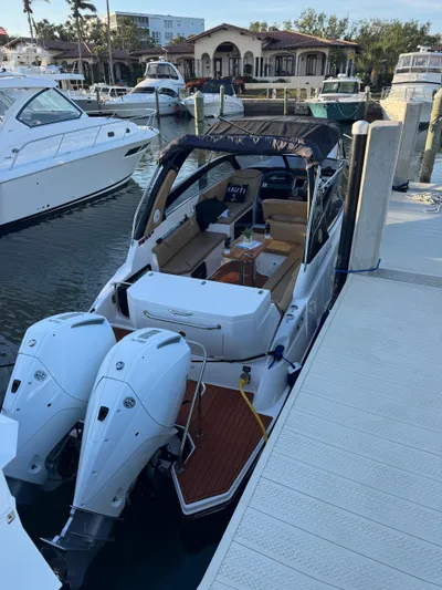  Yacht Photos Pics 2024 Hanover 305 boat docked at marina with twin engines.