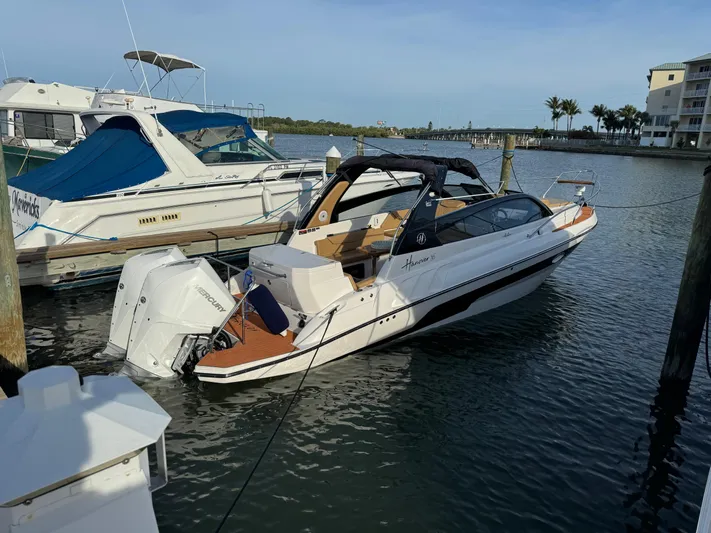  Yacht Photos Pics 2024 Hanover 305 boat docked in marina, featuring sleek design and modern amenities.