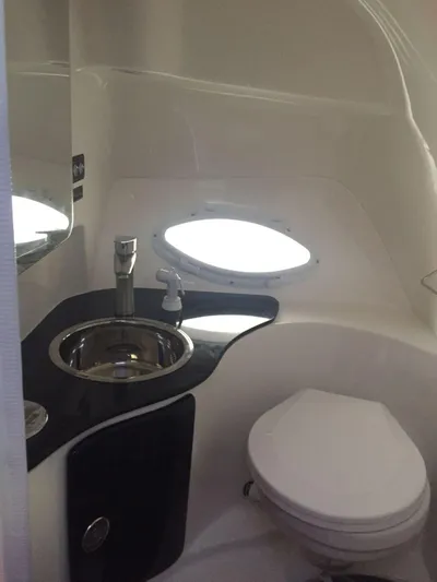  Yacht Photos Pics Modern bathroom in 2024 Hanover 305 model, featuring sleek sink and compact toilet design.