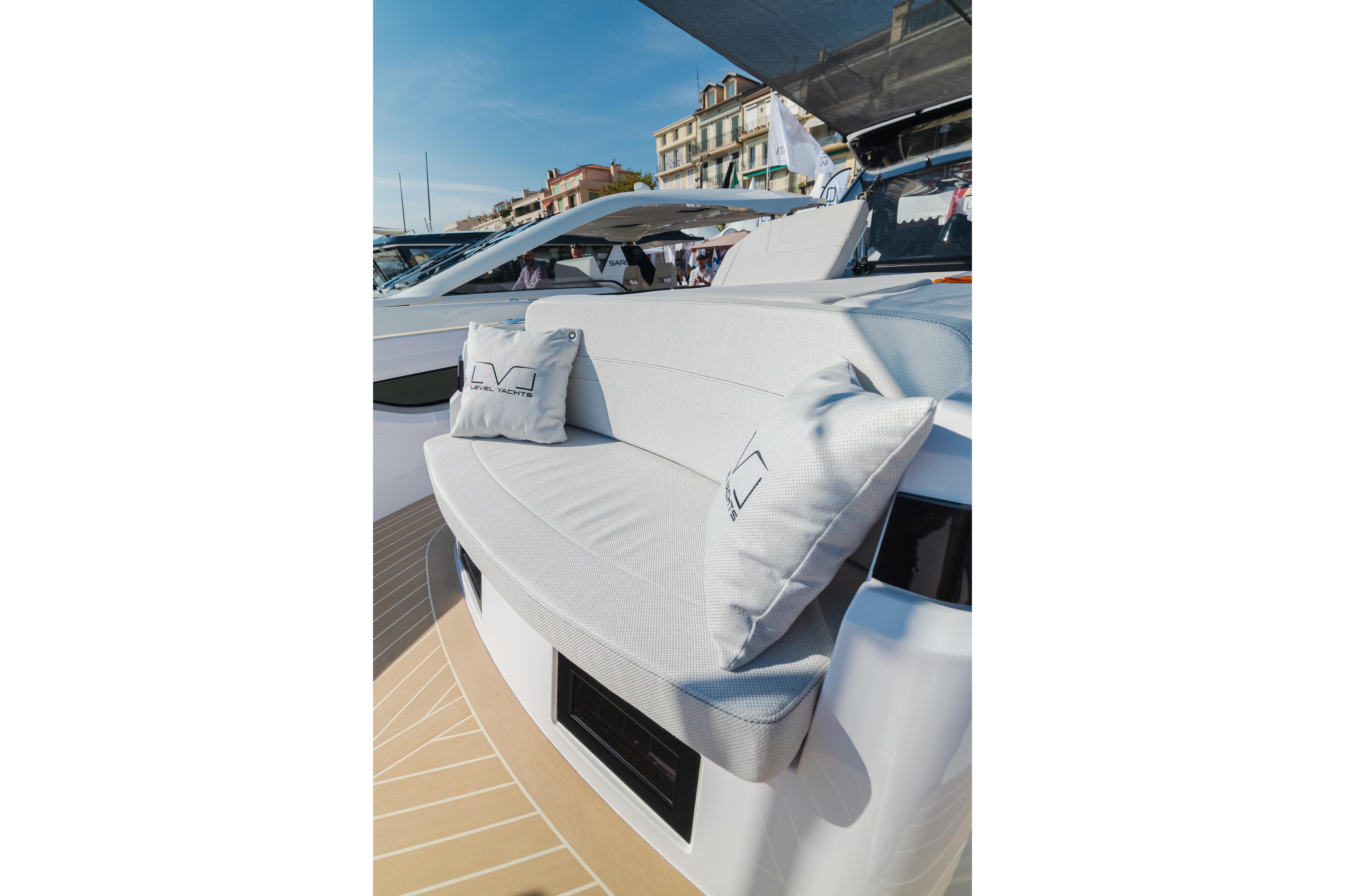 Luxurious seating on 2026 Level Yachts 43 ST, featuring elegant cushions and sleek design.