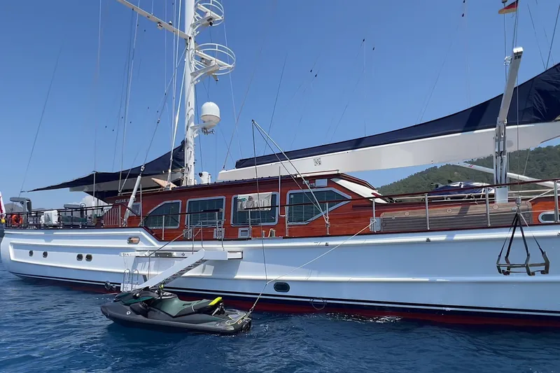  Yacht Photos Pics Custom-Craft Steel Pax Navi 43 m yacht, 2010 model, anchored in clear blue waters.