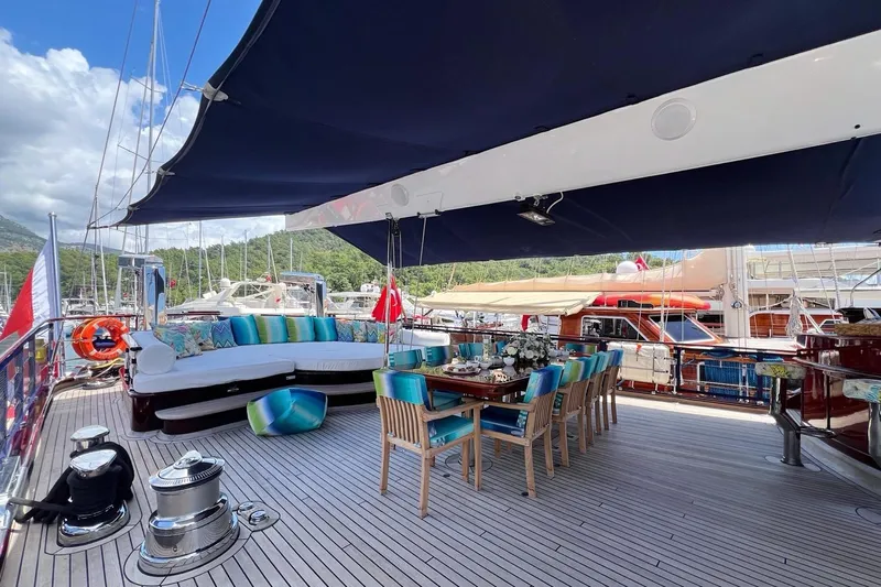  Yacht Photos Pics Luxurious 2010 Custom-Craft Steel Pax Navi yacht deck with elegant seating and dining area.