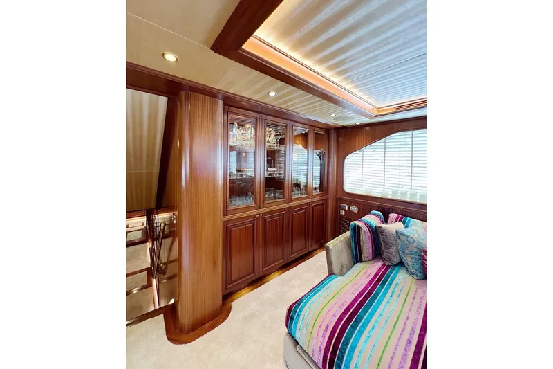  Yacht Photos Pics Luxurious yacht interior with wooden cabinetry and colorful striped seating, Custom-Craft Steel Pax Navi 43 m, 2010.