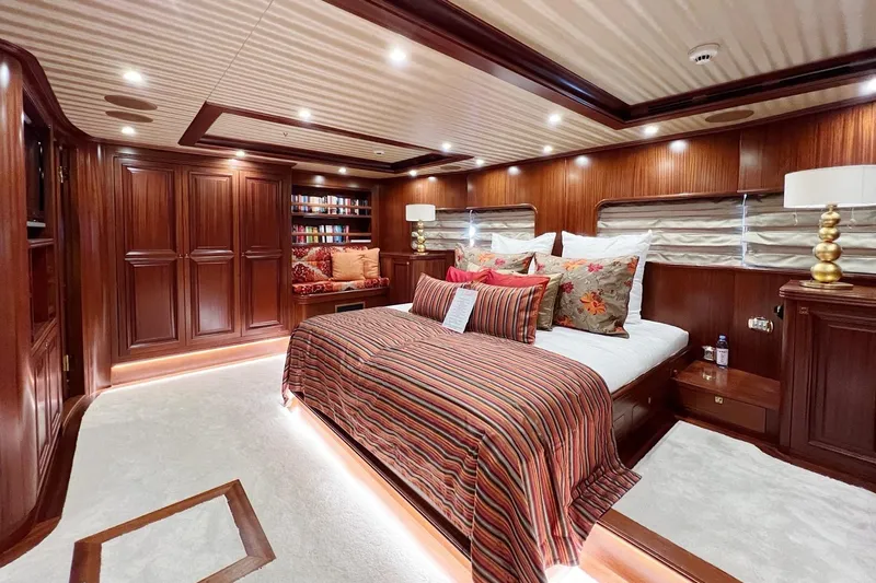  Yacht Photos Pics Luxurious yacht bedroom with elegant wood paneling, plush bedding, and ambient lighting, Custom-Craft Steel Pax Navi 43 m.