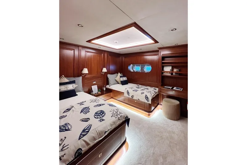  Yacht Photos Pics Luxurious yacht bedroom with wooden paneling, nautical-themed bedding, and ambient lighting, Custom-Craft Steel Pax Navi 43 m, 2010.
