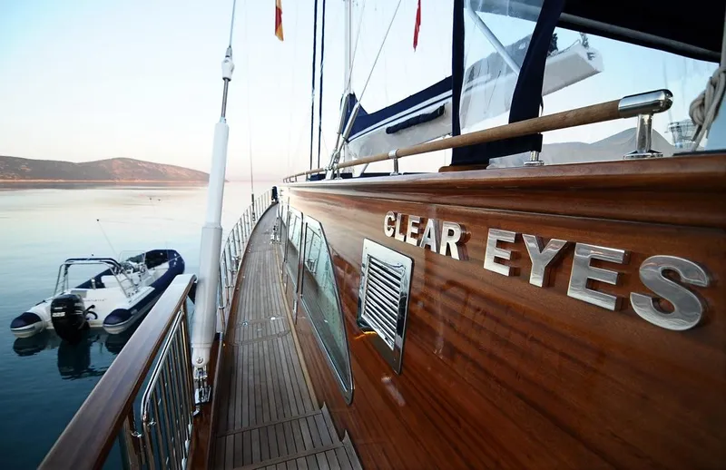  Yacht Photos Pics Luxurious Custom-Craft Steel Pax Navi yacht "Clear Eyes" docked, showcasing elegant wooden deck.