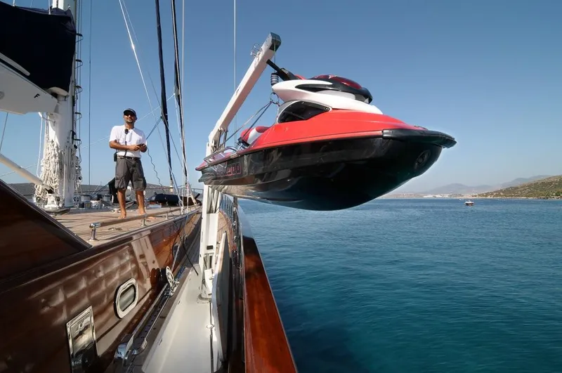  Yacht Photos Pics A jet ski being lifted onto a Custom-Craft Steel Pax Navi 43 m yacht, 2010 model.