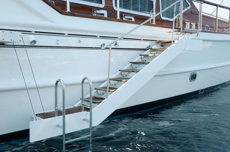  Yacht Photos Pics Staircase on Custom-Craft Steel Pax Navi 43 m yacht, 2010 model, leading to water.