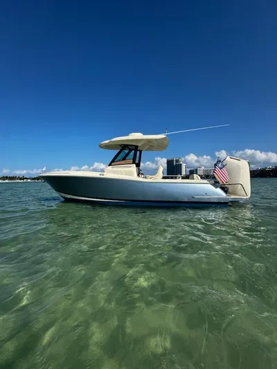  Yacht Photos Pics 2024 Chris-Craft Catalina 24 boat on clear water under blue sky.