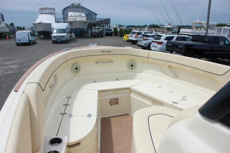  Yacht Photos Pics 2024 Chris-Craft Catalina 24 boat interior with seating, parked in a marina.