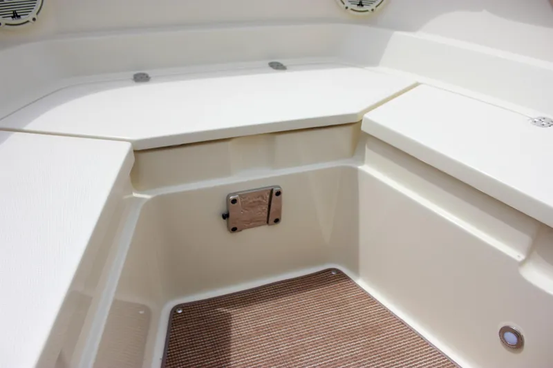  Yacht Photos Pics 2024 Chris-Craft Catalina 24 boat interior with seating and storage area.