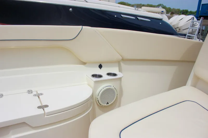 Yacht Photos Pics 2024 Chris-Craft Catalina 24 interior with cup holders and speaker detail.