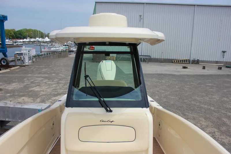  Yacht Photos Pics 2024 Chris-Craft Catalina 24 boat at dock, featuring sleek design and spacious deck.