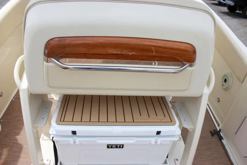  Yacht Photos Pics 2024 Chris-Craft Catalina 24 boat interior with Yeti cooler and wooden accents.