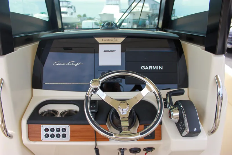  Yacht Photos Pics 2024 Chris-Craft Catalina 24 helm with Garmin navigation and Mercury controls.