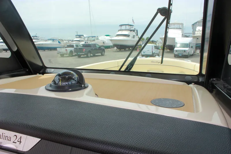  Yacht Photos Pics 2024 Chris-Craft Catalina 24 dashboard view with compass, marina background.