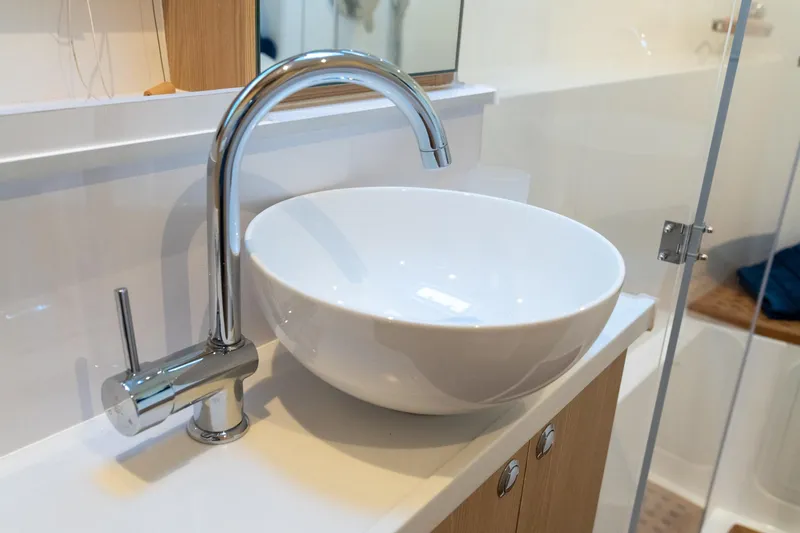Superlux Yacht Photos Pics Modern bathroom sink with chrome faucet on 2023 Aquila 42 Yacht.