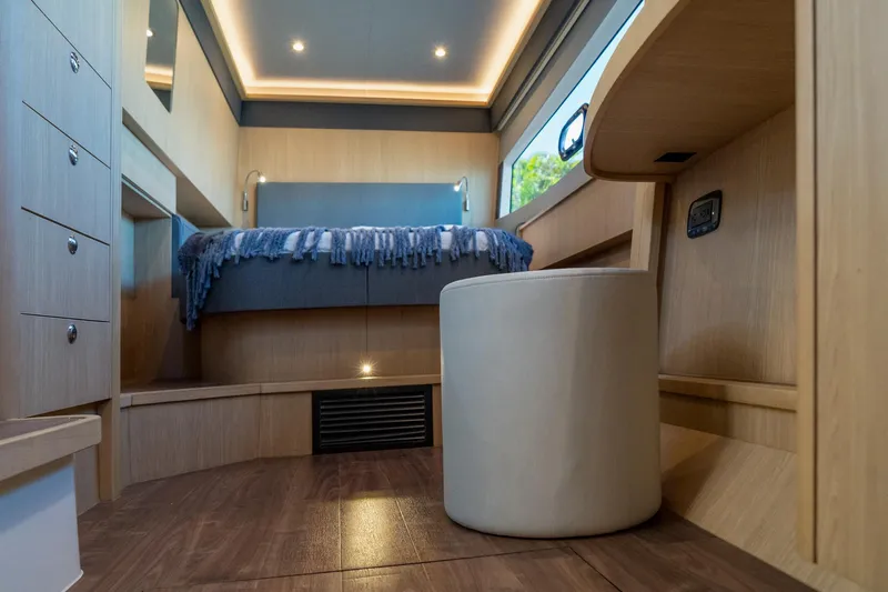 Superlux Yacht Photos Pics Luxurious interior of 2023 Aquila 42 Yacht with modern design and cozy bedroom.