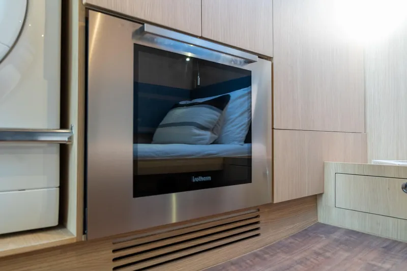 Superlux Yacht Photos Pics Modern kitchen interior of 2023 Aquila 42 Yacht with sleek appliances.