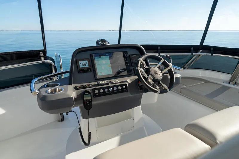 Superlux Yacht Photos Pics Helm of 2023 Aquila 42 Yacht with navigation controls and ocean view.