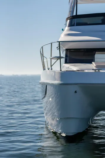 Superlux Yacht Photos Pics 2023 Aquila 42 Yacht on calm water, showcasing sleek design and modern features.