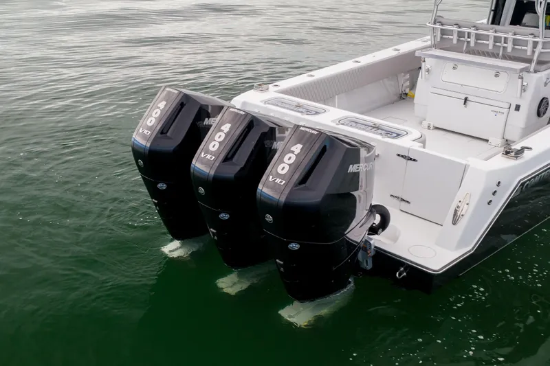  Yacht Photos Pics 2016 Contender 39 ST boat with triple Mercury 400 V10 outboard engines on water.
