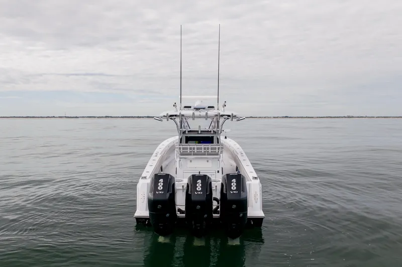  Yacht Photos Pics 2016 Contender 39 ST boat with triple 400 V10 engines on calm water.